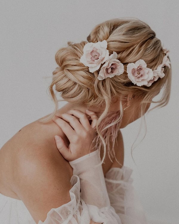 Romantic Braided Updo with Floral Embellishments