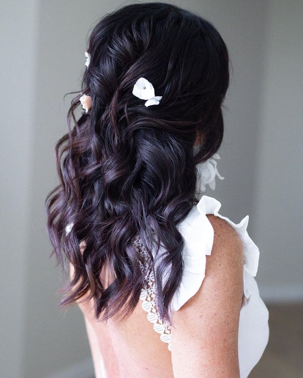 Dark Tousled Waves with Floral Embellishments