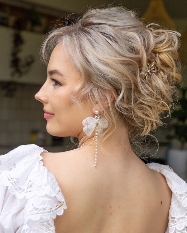 Romantic Tousled Updo with Floral Earrings