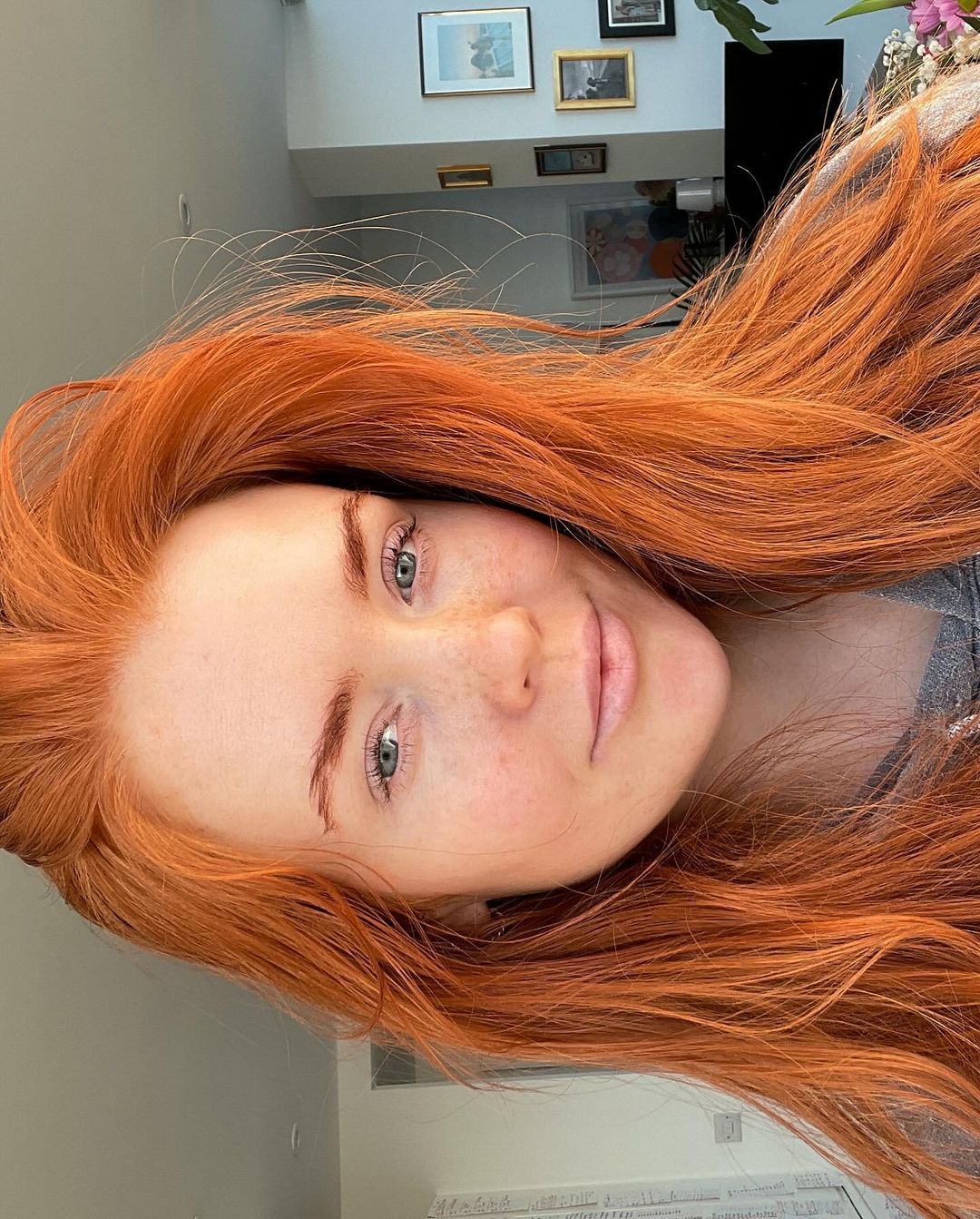 A woman with striking red hair